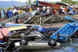 Tsunamis triggered by a massive earthquake in Indonesia smashed into coastal areas of the Indian Ocean ring nations Sunday, destroying villages and flooding cities and killing more than 11,000 people. The death toll is increasing as counting of bodies washed up on beaches is continuing while thousands were reported missing. Tens of thousands fled the coasts for higher ground, fearing aftershocks and further flood surges.