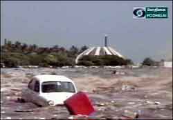 A car floating after tidal waves hit the region of Madras. From hardest-hit Sri Lanka to resort islands in Thailand, holidaymakers from Britain described the destruction caused when tidal waves triggered by a powerful earthquake off Indonesia hit their resorts, in messages to radio, television stations and news agencies back home.