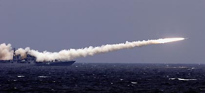 A Chinese warship fires missiles during a China-Russia joint military exercise off China's Shandong Peninsula August 23, 2005.